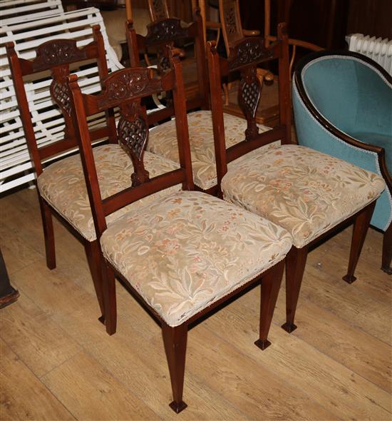 A set of four Edwardian walnut dining chairs